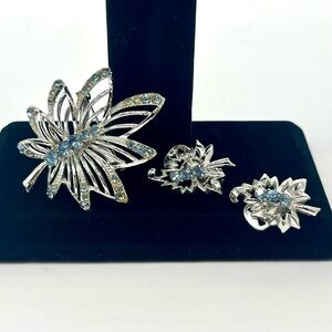 Vintage blue rhinestone butterfly brooch with matching clip earrings silver tone
